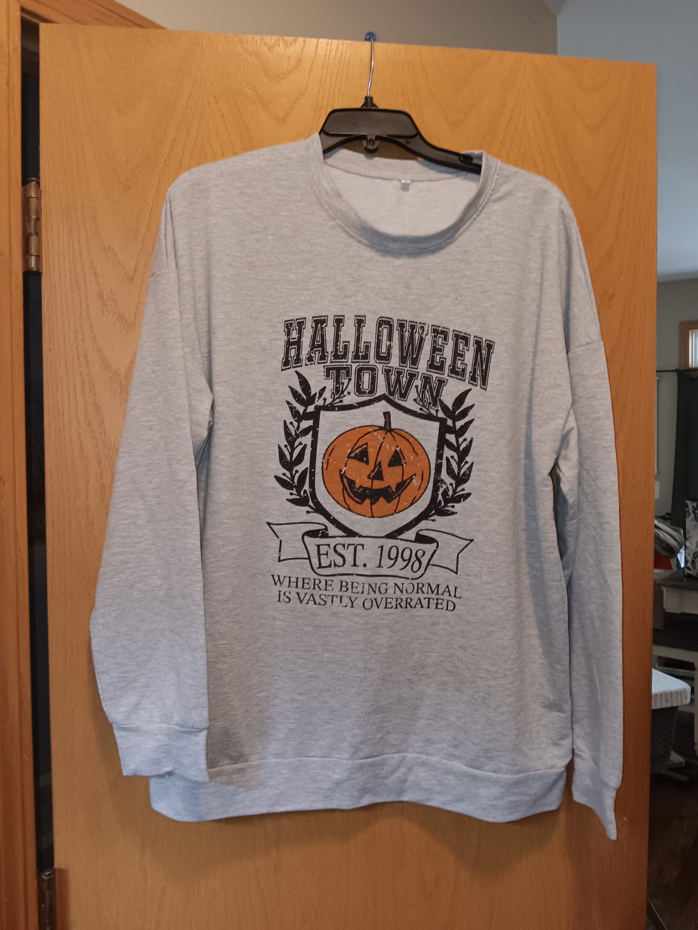 Light Gray Crewneck Sweatshirt with Orange Pumpkin Graphic